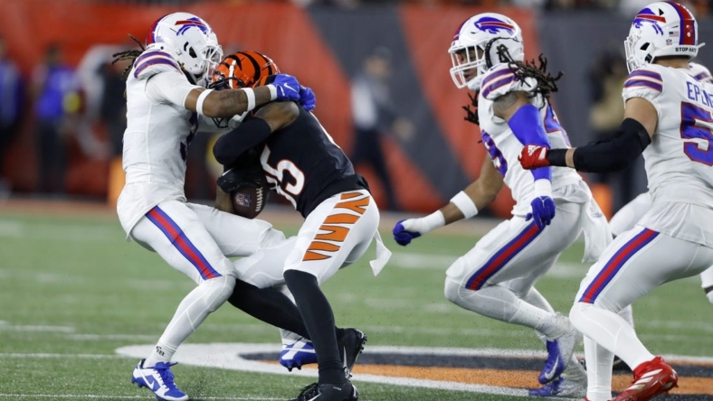 Jan 2, 2023; Cincinnati, Ohio, USA; Buffalo Bills safety Damar Hamlin (3) makes the tackle on Cincinnati Bengals wide receiver Tee Higgins (85) during the first quarterat Paycor Stadium. The play led to Hamlin collapsing on the field, and being taken to the hospital in critical condition. Mandatory Credit: Joseph Maiorana-USA TODAY Sports