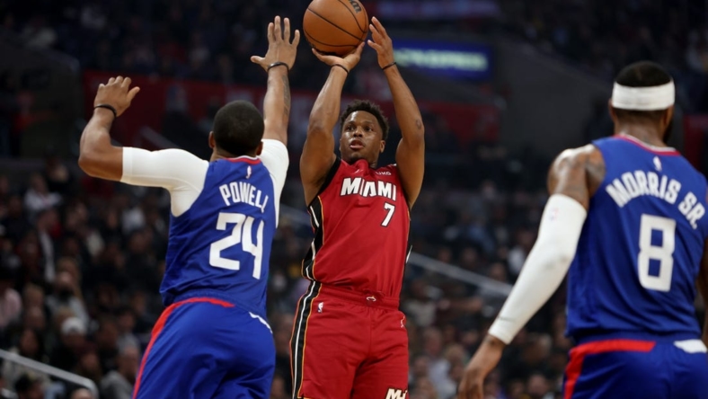 Jan 2, 2023; Los Angeles, California, USA;  Miami Heat guard Kyle Lowry (7) shoots the ball over Los Angeles Clippers forward Norman Powell (24) during the first quarter at Crypto.com Arena. Mandatory Credit: Kiyoshi Mio-USA TODAY Sports