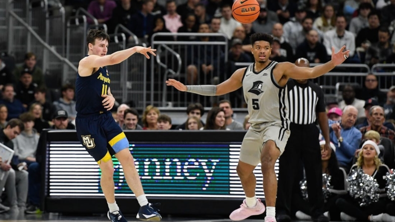 Dec 20, 2022; Providence, Rhode Island, USA; Marquette Golden Eagles guard Tyler Kolek (11) passes the ball during the first half against the Providence Friars at Amica Mutual Pavilion. Mandatory Credit: Eric Canha-USA TODAY Sports