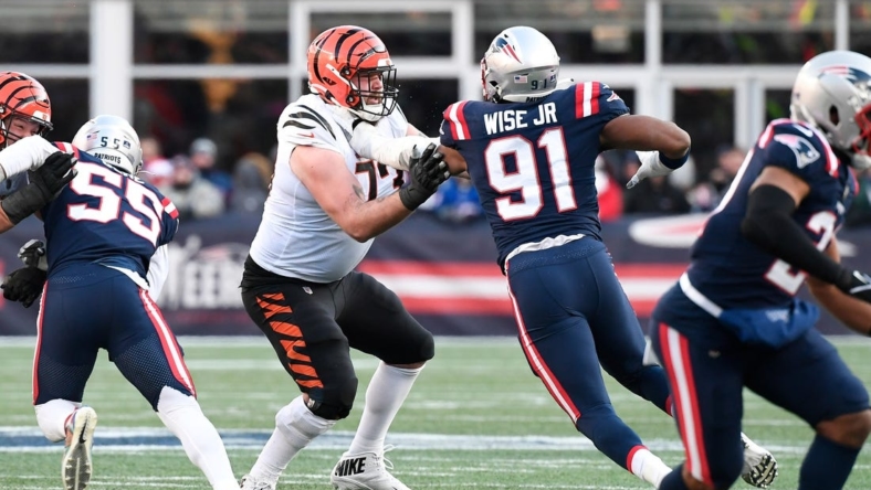 Dec 24, 2022; Foxborough, Massachusetts, USA; Cincinnati Bengals offensive tackle Jonah Williams (73) blocks New England Patriots defensive end Deatrich Wise Jr. (91) during the first half at Gillette Stadium. Mandatory Credit: Eric Canha-USA TODAY Sports