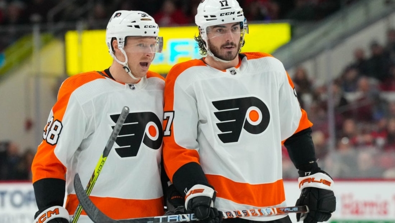 Dec 23, 2022; Raleigh, North Carolina, USA;  Philadelphia Flyers center Patrick Brown (38) and center Zack MacEwen (17) talk against the Carolina Hurricanes during the second period at PNC Arena. Mandatory Credit: James Guillory-USA TODAY Sports