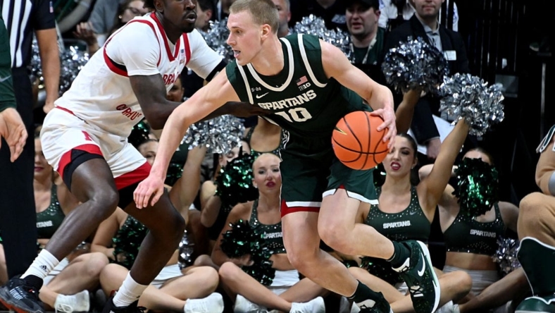 Jan 3, 2023; East Lansing, Michigan, USA;  Michigan State Spartans forward Joey Hauser (10) drives past Nebraska Cornhuskers forward Juwan Gary (4) in the first half at Jack Breslin Student Events Center. Mandatory Credit: Dale Young-USA TODAY Sports