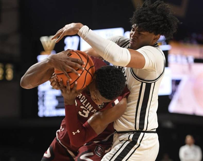 Jan 3, 2023; Nashville, Tennessee, USA; South Carolina Gamecocks forward Gregory Jackson II (23) and Vanderbilt Commodores guard Tyrin Lawrence (0) fight for the loose ball during the second half at Memorial Gymnasium. Mandatory Credit: Steve Roberts-USA TODAY Sports