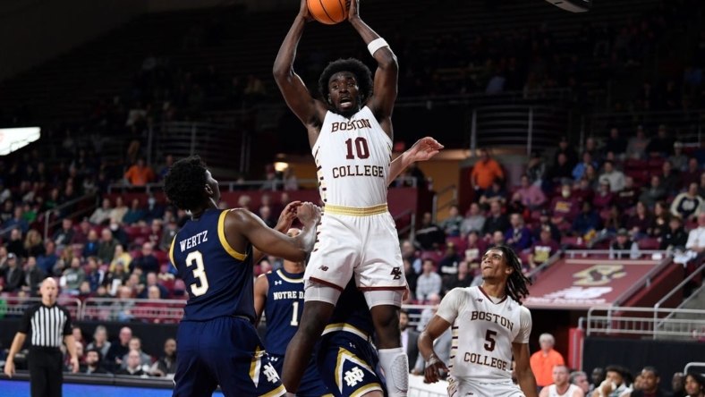 Jan 3, 2023; Chestnut Hill, Massachusetts, USA; Boston College Eagles guard Prince Aligbe (10) comes down with a rebound  during the second half against the Notre Dame Fighting Irish at Conte Forum. Mandatory Credit: Eric Canha-USA TODAY Sports