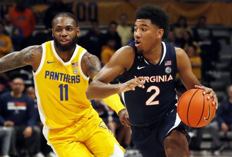 Jan 3, 2023; Pittsburgh, Pennsylvania, USA;  Virginia Cavaliers guard Reece Beekman (2) drives to the basket against Pittsburgh Panthers guard Jamarius Burton (11) during the first half at the Petersen Events Center. Mandatory Credit: Charles LeClaire-USA TODAY Sports