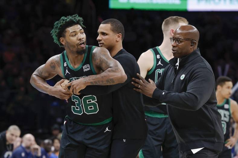 Jan 3, 2023; Oklahoma City, Oklahoma, USA; Boston Celtics guard Marcus Smart (36) is held back by head coach Joe Mazzulla after he reacts to getting ejected following a play against the Oklahoma City Thunder in the second half at Paycom Center. Oklahoma City won 150-117. Mandatory Credit: Alonzo Adams-USA TODAY Sports