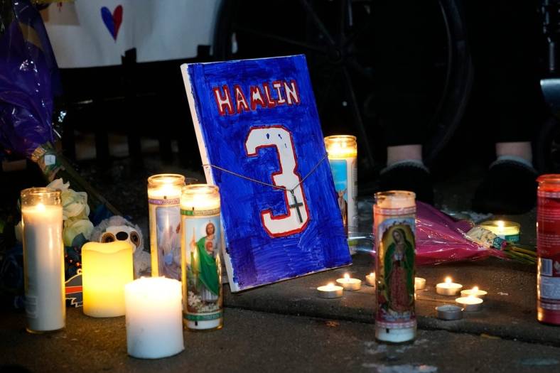A painting and other items to honor Buffalo Bills safety Damar Hamlin were left outside of the University of Cincinnati Medical Center. A vigil was held  Tuesday, January 3, 2023, for Hamlin collapsed during the Monday Night Football game with the Bengals. Hamlin remains in critical condition at the UC Medical Center.

Vigil8