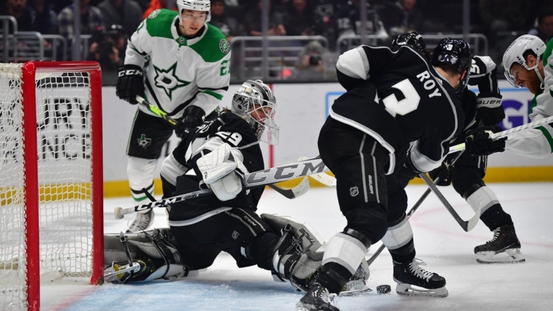 Jan 3, 2023; Los Angeles, California, USA; Los Angeles Kings defenseman Matt Roy (3) helps goaltender Pheonix Copley (29) defend the goal against Dallas Stars center Joe Pavelski (16) during the first period at Crypto.com Arena. Mandatory Credit: Gary A. Vasquez-USA TODAY Sports