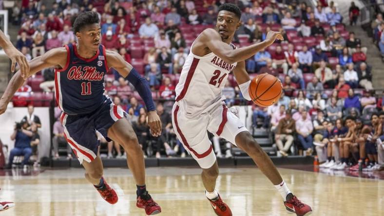 Jan 3, 2023; Tuscaloosa, Alabama, USA; Alabama Crimson Tide forward Brandon Miller (24) drives to the basket against Mississippi Rebels guard Matthew Murrell (11) during the second half at Coleman Coliseum. Mandatory Credit: Marvin Gentry-USA TODAY Sports