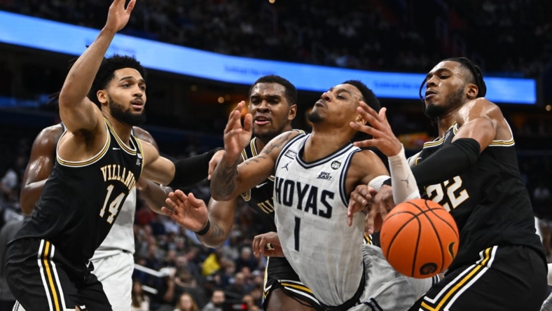 Jan 4, 2023; Washington, District of Columbia, USA; Georgetown Hoyas guard Primo Spears (1) is fouled by Villanova Wildcats forward Cam Whitmore (22) during the second half at Capital One Arena. Mandatory Credit: Brad Mills-USA TODAY Sports