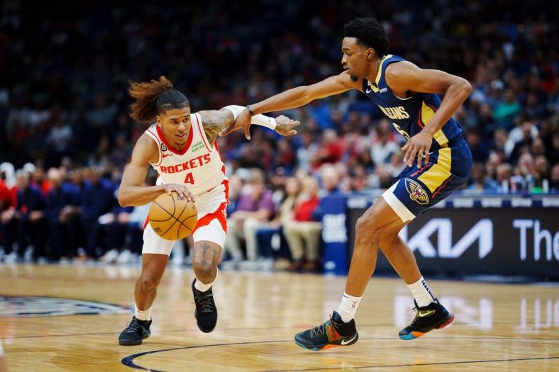 Jan 4, 2023; New Orleans, Louisiana, USA; Houston Rockets guard Jalen Green (4) drives to the basket against New Orleans Pelicans forward Herbert Jones (5) during the first quarter at Smoothie King Center. Mandatory Credit: Andrew Wevers-USA TODAY Sports