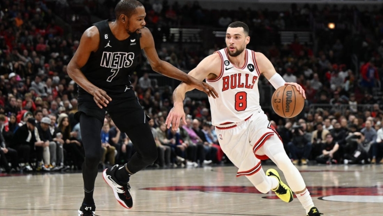 Jan 4, 2023; Chicago, Illinois, USA; Chicago Bulls guard Zach LaVine (8) drives in the first half against Brooklyn Nets forward Kevin Durant (7) at United Center. Mandatory Credit: Quinn Harris-USA TODAY Sports
