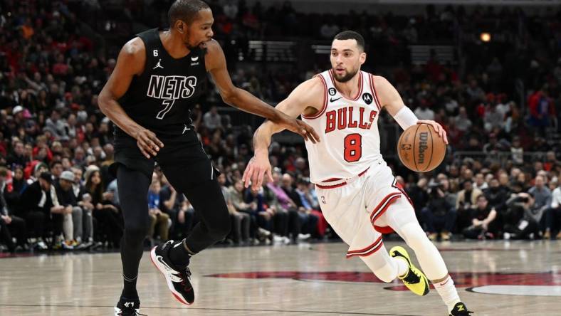 Jan 4, 2023; Chicago, Illinois, USA; Chicago Bulls guard Zach LaVine (8) drives in the first half against Brooklyn Nets forward Kevin Durant (7) at United Center. Mandatory Credit: Quinn Harris-USA TODAY Sports