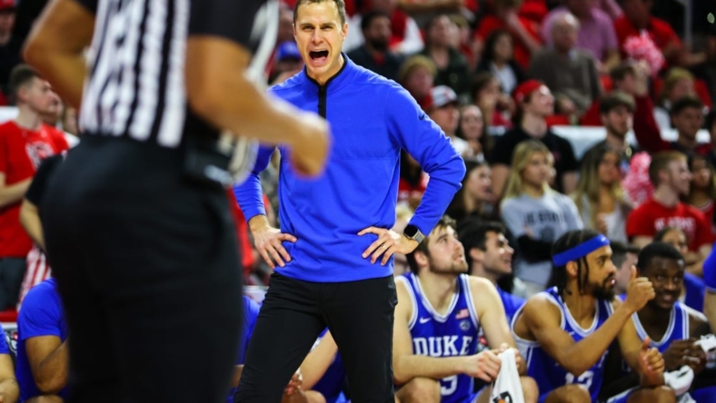Jan 4, 2023; Raleigh, North Carolina, USA;  Duke Blue Devils coach Jon Scheyer shouts at the referee during the second half against North Carolina State Wolfpack at PNC Arena. Mandatory Credit: Jaylynn Nash-USA TODAY Sports