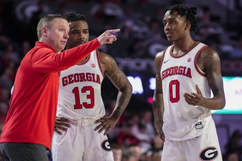 Jan 4, 2023; Athens, Georgia, USA; Georgia Bulldogs head coach Mike White coaches guards Mardrez McBride (13) and Terry Roberts (0) against the Auburn Tigers during the second half at Stegeman Coliseum. Mandatory Credit: Dale Zanine-USA TODAY Sports