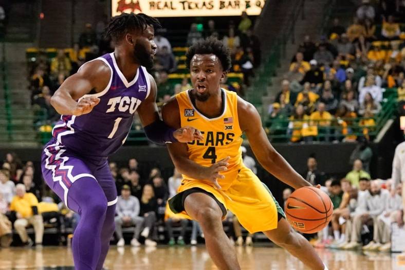 Jan 4, 2023; Waco, Texas, USA; Baylor Bears guard LJ Cryer (4) drives to the basket against TCU Horned Frogs guard Mike Miles Jr. (1) during the first half at Ferrell Center. Mandatory Credit: Chris Jones-USA TODAY Sports