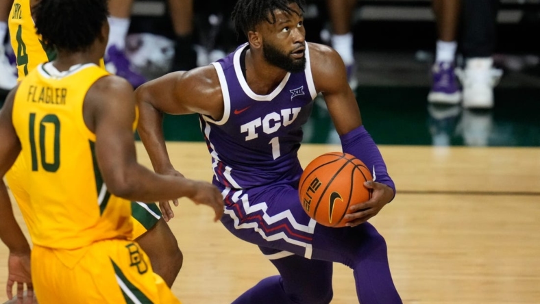 Jan 4, 2023; Waco, Texas, USA; TCU Horned Frogs guard Mike Miles Jr. (1) drives to the basket against Baylor Bears guard Adam Flagler (10) during the second half at Ferrell Center. Mandatory Credit: Chris Jones-USA TODAY Sports