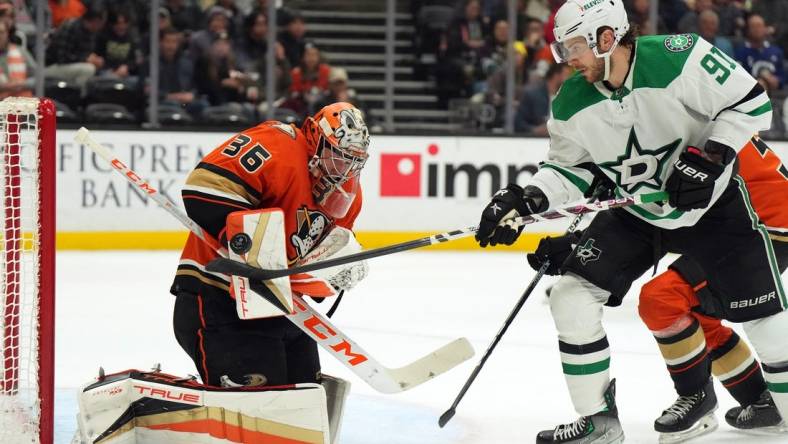 Jan 4, 2023; Anaheim, California, USA; Anaheim Ducks goaltender John Gibson (36) defends the goal against Dallas Stars center Tyler Seguin (91) in the second period at Honda Center. Mandatory Credit: Kirby Lee-USA TODAY Sports