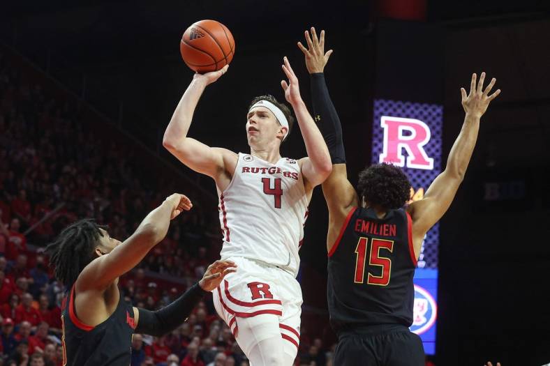 Jan 5, 2023; Piscataway, New Jersey, USA; Rutgers Scarlet Knights guard Paul Mulcahy (4) shoots the ball as Maryland Terrapins guard Ian Martinez (23) and forward Patrick Emilien (15) defends during the second half at Jersey Mike's Arena. Mandatory Credit: Vincent Carchietta-USA TODAY Sports