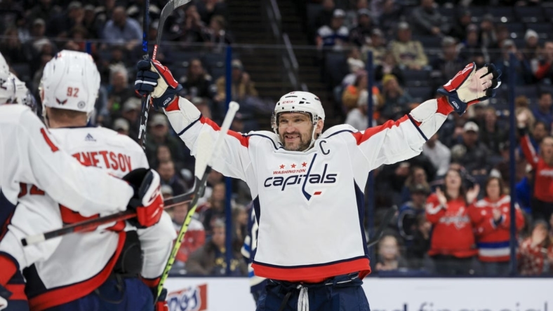Jan 5, 2023; Columbus, Ohio, USA;  Washington Capitals left wing Alex Ovechkin (8) celebrates the goal scored by right wing T.J. Oshie (77) in the game against the Columbus Blue Jackets in the third period at Nationwide Arena. Mandatory Credit: Aaron Doster-USA TODAY Sports