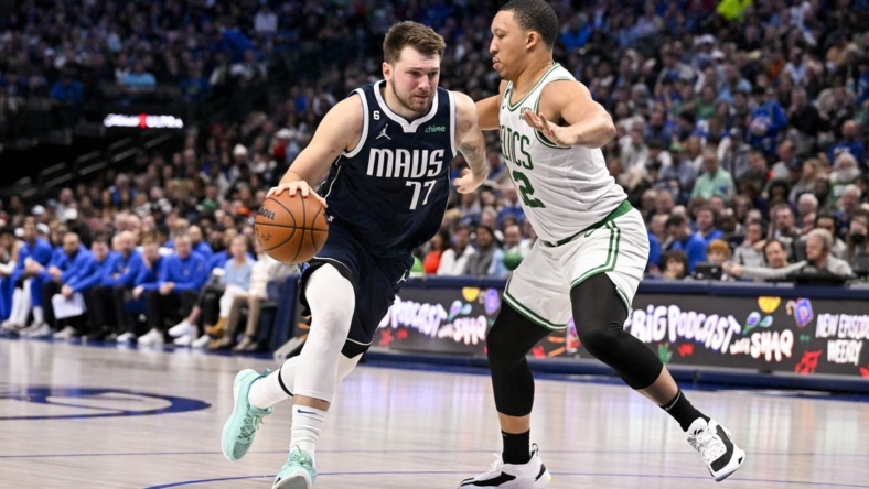 Jan 5, 2023; Dallas, Texas, USA; Dallas Mavericks guard Luka Doncic (77) drives to the basket against Boston Celtics forward Grant Williams (12) during the second half at the American Airlines Center. Mandatory Credit: Jerome Miron-USA TODAY Sports