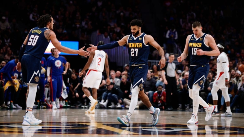 Jan 5, 2023; Denver, Colorado, USA; Denver Nuggets forward Aaron Gordon (50) reacts with guard Jamal Murray (27) and center Nikola Jokic (15) in the first quarter against the Los Angeles Clippers at Ball Arena. Mandatory Credit: Isaiah J. Downing-USA TODAY Sports