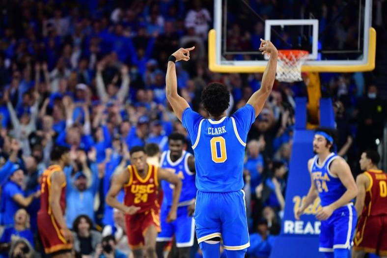 Jan 5, 2023; Los Angeles, California, USA; UCLA Bruins guard Jaylen Clark (0) celebrates his three point basket scored against the Southern California Trojans during the second half at Pauley Pavilion. Mandatory Credit: Gary A. Vasquez-USA TODAY Sports