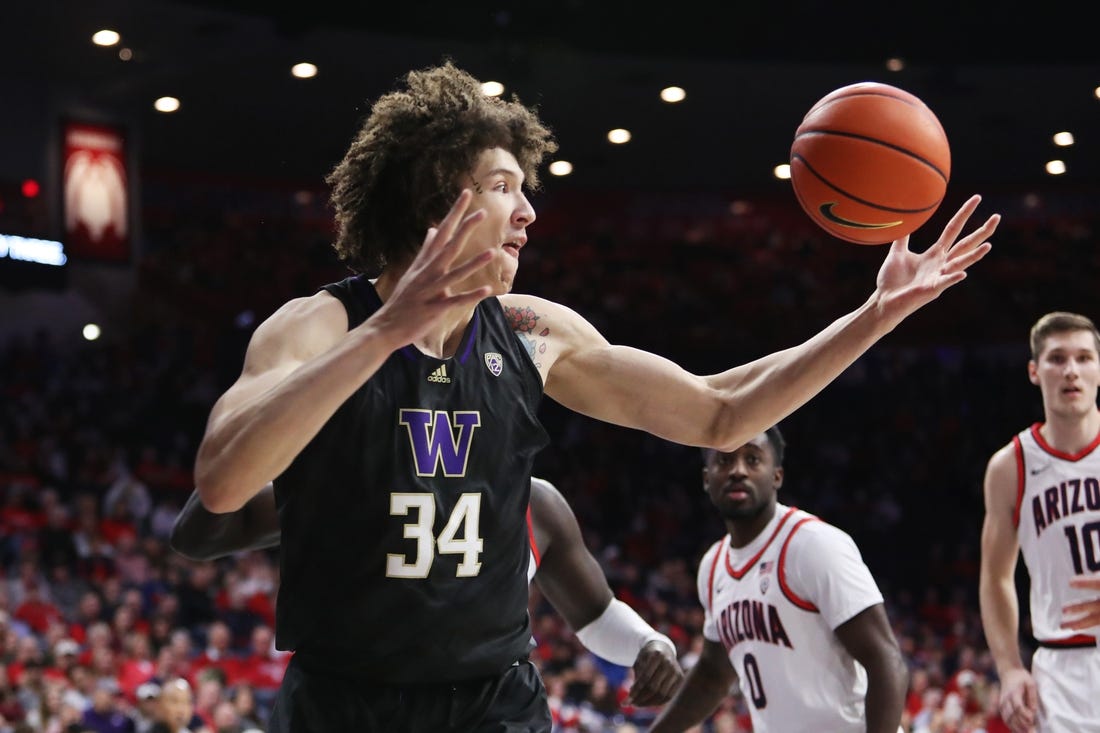 Jan 5, 2023; Tucson, Arizona, USA; Washington Huskies center Braxton Meah (34) gets a rebound in the first half at McKale Center. Mandatory Credit: Zachary BonDurant-USA TODAY Sports