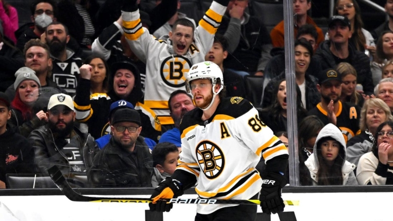 Jan 5, 2023; Los Angeles, California, USA;  Boston Bruins celebrate after an empty net goal by right wing David Pastrnak (88) in the third period against the Los Angeles Kings at Crypto.com Arena. Mandatory Credit: Jayne Kamin-Oncea-USA TODAY Sports