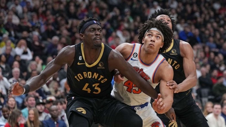 Jan 6, 2023; Toronto, Ontario, CAN; New York Knicks center Jericho Sims (45) battles for the rebound with Toronto Raptors forward Pascal Siakam (43) and Toronto Raptors forward Scottie Barnes (4) during the second quarter at Scotiabank Arena. Mandatory Credit: Nick Turchiaro-USA TODAY Sports