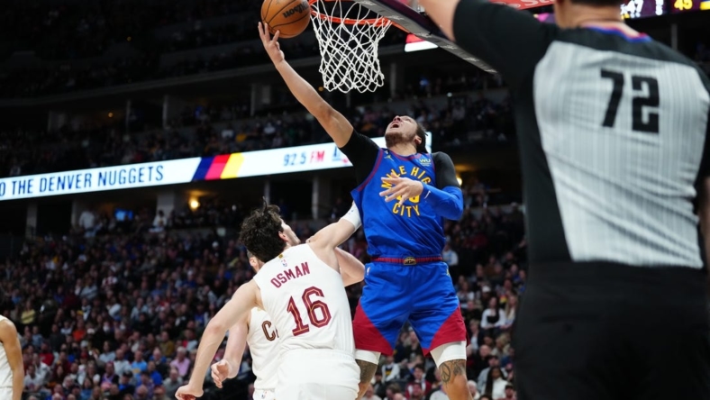 Jan 6, 2023; Denver, Colorado, USA; Denver Nuggets forward Aaron Gordon (50) shoots the ball over Cleveland Cavaliers forward Cedi Osman (16) in the second quarter at Ball Arena. Mandatory Credit: Ron Chenoy-USA TODAY Sports