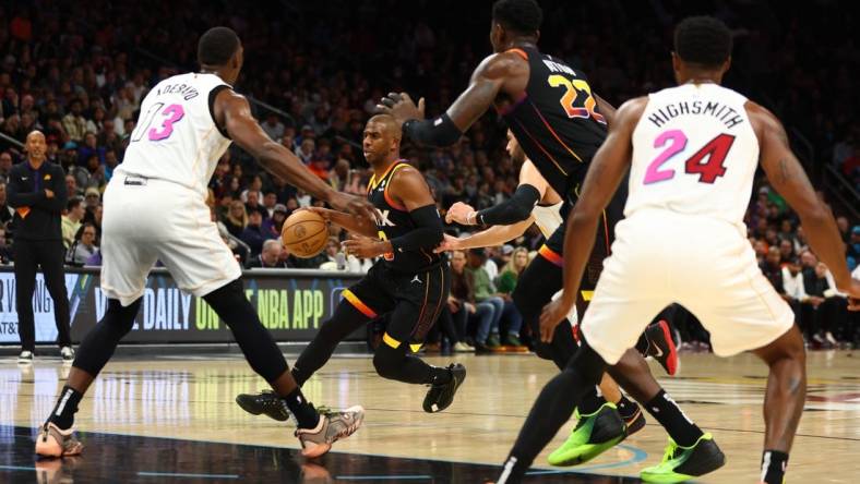 Jan 6, 2023; Phoenix, Arizona, USA; Phoenix Suns guard Chris Paul (3) against the Miami Heat in the first half at Footprint Center. Mandatory Credit: Mark J. Rebilas-USA TODAY Sports