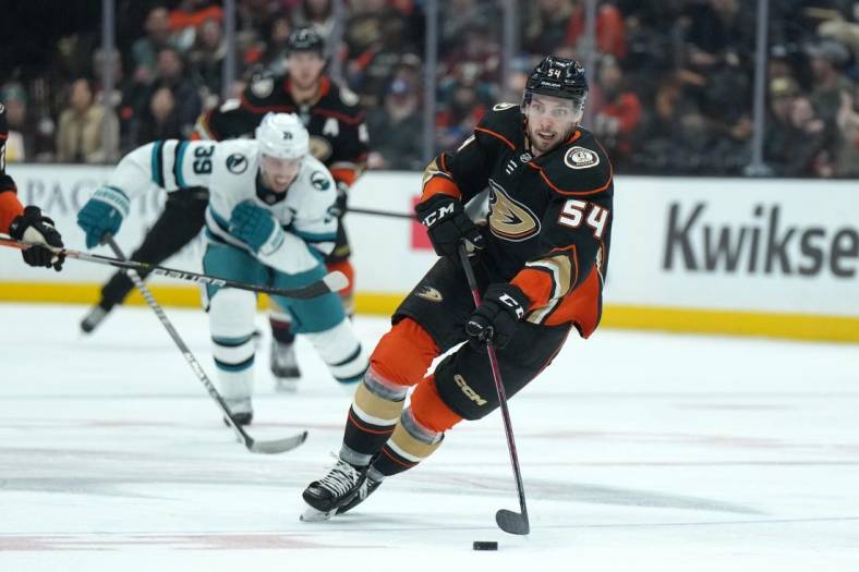 Jan 6, 2023; Anaheim, California, USA; Anaheim Ducks center Justin Kirkland (54) skates with the puck against the San Jose Sharks in the second period at Honda Center. Mandatory Credit: Kirby Lee-USA TODAY Sports