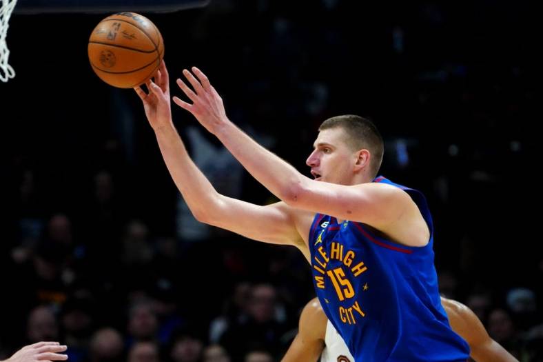 Jan 6, 2023; Denver, Colorado, USA; Denver Nuggets center Nikola Jokic (15) passes the ball in the second half against the Cleveland Cavaliers at Ball Arena. Mandatory Credit: Ron Chenoy-USA TODAY Sports