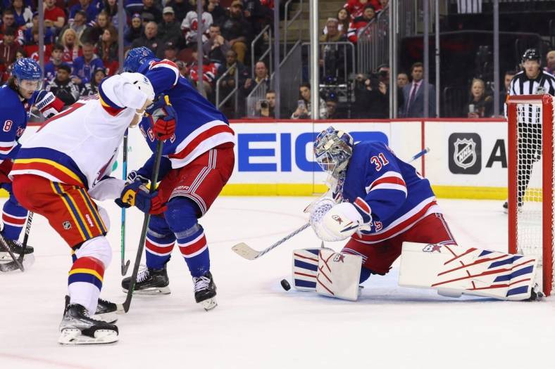 Jan 7, 2023; Newark, New Jersey, USA; New York Rangers goaltender Igor Shesterkin (31) makes a save against the New Jersey Devils during the second period at Prudential Center. Mandatory Credit: Ed Mulholland-USA TODAY Sports