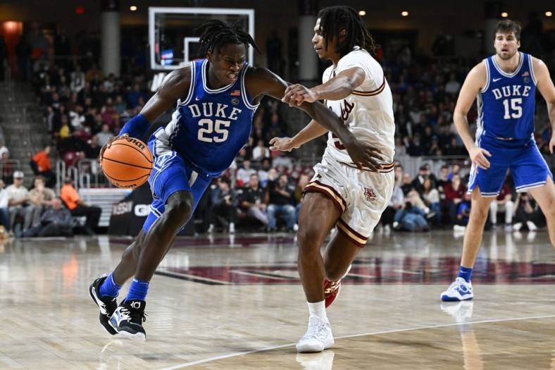 Jan 7, 2023; Chestnut Hill, Massachusetts, USA; Duke Blue Devils forward Mark Mitchell (25) drives to the basket against Boston College Eagles guard DeMarr Langford Jr. (5) during the second half at the Conte Forum. Mandatory Credit: Brian Fluharty-USA TODAY Sports