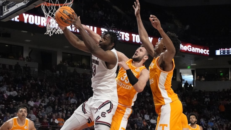 Jan 7, 2023; Columbia, South Carolina, USA; South Carolina Gamecocks forward Josh Gray (33) tries to hang onto the rebound pressured by Tennessee Volunteers forward Uros Plavsic (33) during the first half at Colonial Life Arena. Mandatory Credit: Jim Dedmon-USA TODAY Sports
