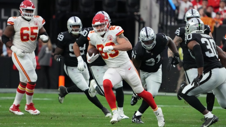Jan 7, 2023; Paradise, Nevada, USA; Kansas City Chiefs tight end Noah Gray (83) carries the ball against the Las Vegas Raiders in the first half at Allegiant Stadium. Mandatory Credit: Kirby Lee-USA TODAY Sports