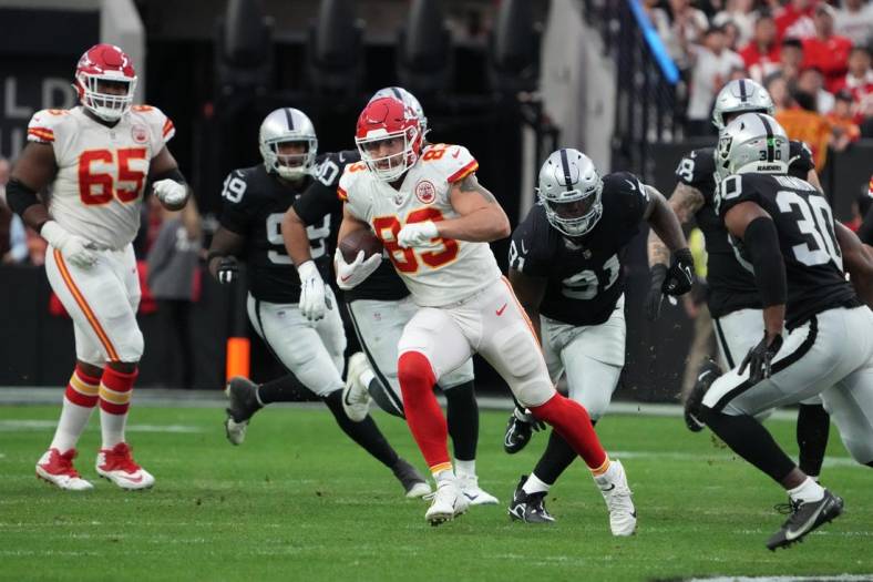 Jan 7, 2023; Paradise, Nevada, USA; Kansas City Chiefs tight end Noah Gray (83) carries the ball against the Las Vegas Raiders in the first half at Allegiant Stadium. Mandatory Credit: Kirby Lee-USA TODAY Sports