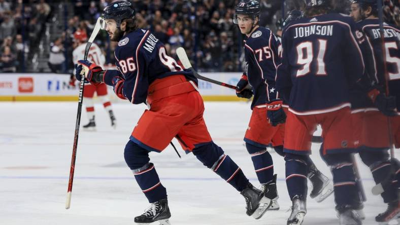Jan 7, 2023; Columbus, Ohio, USA;  Columbus Blue Jackets right wing Kirill Marchenko (86) celebrates with teammates after scoring a goal against the Carolina Hurricanes in the second period at Nationwide Arena. Mandatory Credit: Aaron Doster-USA TODAY Sports