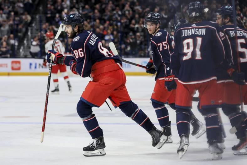 Jan 7, 2023; Columbus, Ohio, USA;  Columbus Blue Jackets right wing Kirill Marchenko (86) celebrates with teammates after scoring a goal against the Carolina Hurricanes in the second period at Nationwide Arena. Mandatory Credit: Aaron Doster-USA TODAY Sports