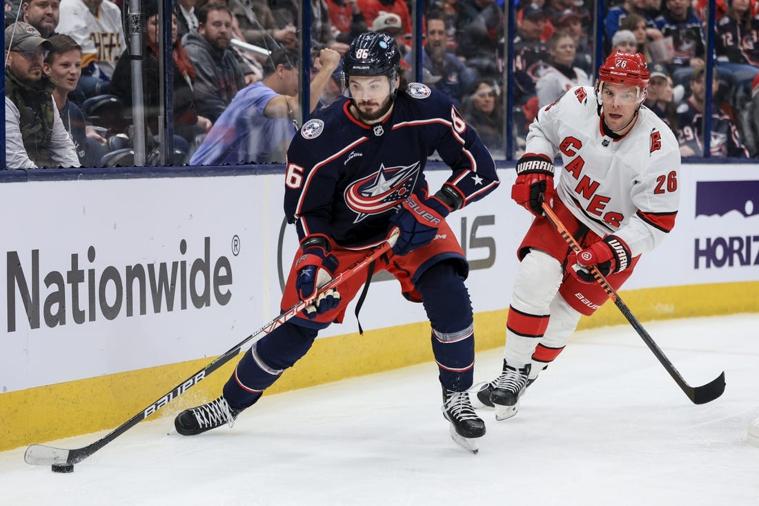 Jan 7, 2023; Columbus, Ohio, USA;  Columbus Blue Jackets right wing Kirill Marchenko (86) controls the puck against Carolina Hurricanes center Paul Stastny (26) in the second period at Nationwide Arena. Mandatory Credit: Aaron Doster-USA TODAY Sports