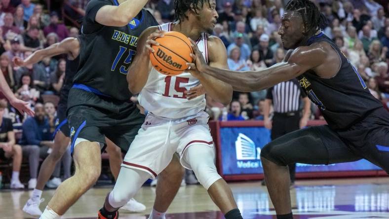 Jan 7, 2023; Charleston, South Carolina, USA; Charleston Cougars guard Pat Robinson III (15) looks for an outlet in the first half against the Delaware Fightin Blue Hens at TD Arena. Mandatory Credit: David Yeazell-USA TODAY Sports