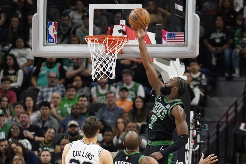 Jan 7, 2023; San Antonio, Texas, USA; Boston Celtics forward Jaylen Brown (7) lays in a basket during the first half against the San Antonio Spurs at AT&T Center. Mandatory Credit: Scott Wachter-USA TODAY Sports
