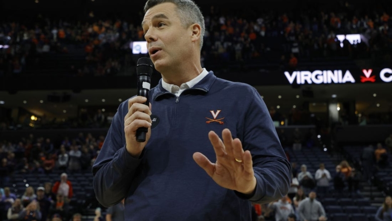 Jan 7, 2023; Charlottesville, Virginia, USA; Virginia Cavaliers head coach Tony Bennett (L) addresses the crowd after becoming the all-time winningest coach in men's basketball program history after the Cavaliers' game against the Syracuse Orange at John Paul Jones Arena. Mandatory Credit: Geoff Burke-USA TODAY Sports