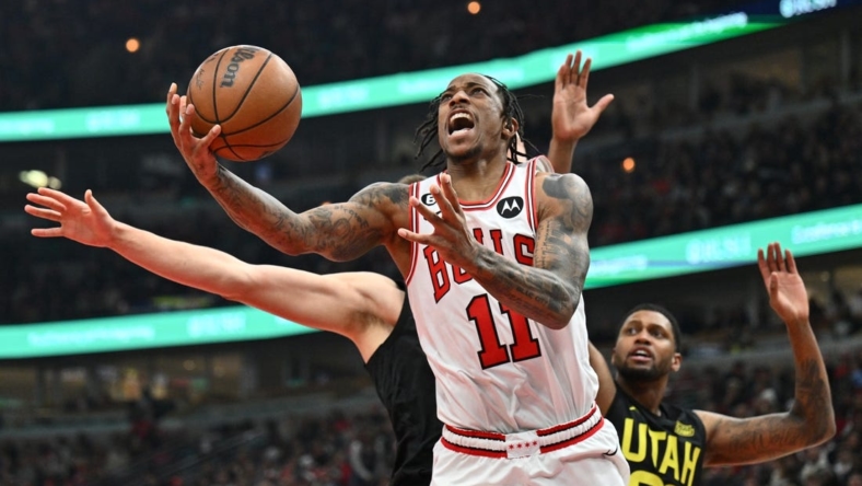Jan 7, 2023; Chicago, Illinois, USA; Chicago Bulls guard DeMar DeRozan (11) attempts a shot under the basket against the Utah Jazz in the second half at United Center. Chicago defeated Utah 126-118. Mandatory Credit: Jamie Sabau-USA TODAY Sports