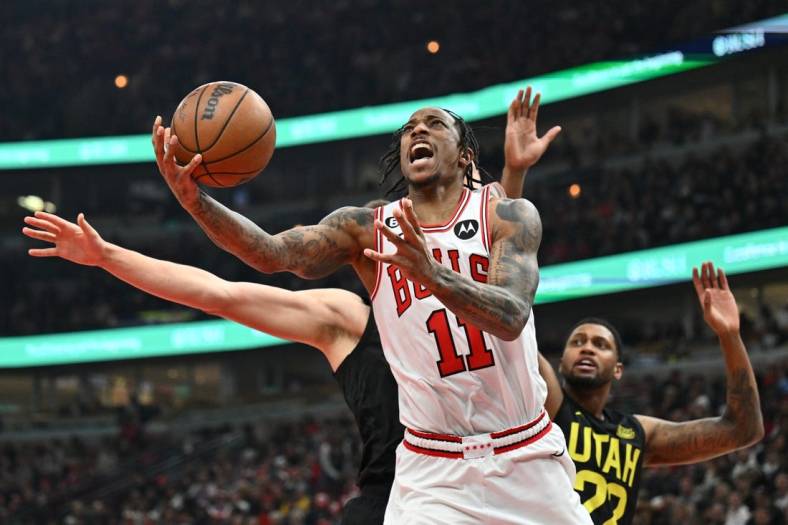 Jan 7, 2023; Chicago, Illinois, USA; Chicago Bulls guard DeMar DeRozan (11) attempts a shot under the basket against the Utah Jazz in the second half at United Center. Chicago defeated Utah 126-118. Mandatory Credit: Jamie Sabau-USA TODAY Sports