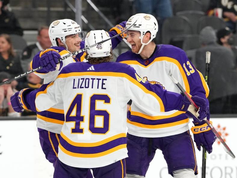 Jan 7, 2023; Las Vegas, Nevada, USA; Los Angeles Kings left wing Kevin Fiala (22) celebrates with right wing Gabriel Vilardi (13) and center Blake Lizotte (46) after scoring his third goal of the game against the Vegas Golden Knights during the third period at T-Mobile Arena. Mandatory Credit: Stephen R. Sylvanie-USA TODAY Sports