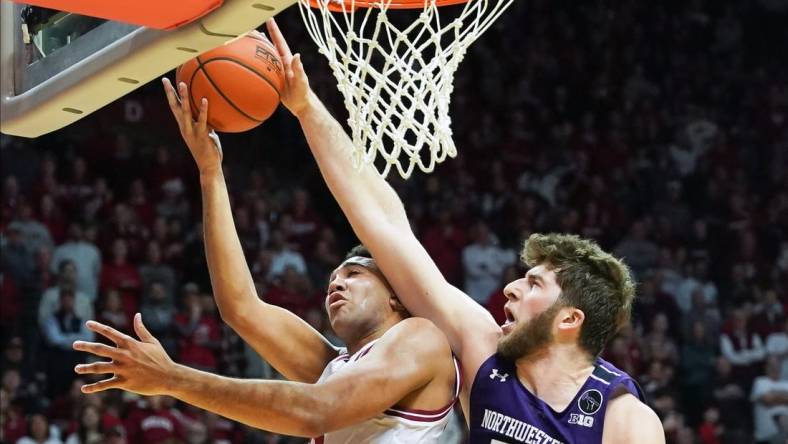 Jan 8, 2023; Bloomington, Indiana, USA;  Northwestern Wildcats center Matthew Nicholson (34) blocks the shot attempt from Indiana Hoosiers forward Trayce Jackson-Davis (23) during the first half at Simon Skjodt Assembly Hall. Mandatory Credit: Robert Goddin-USA TODAY Sports