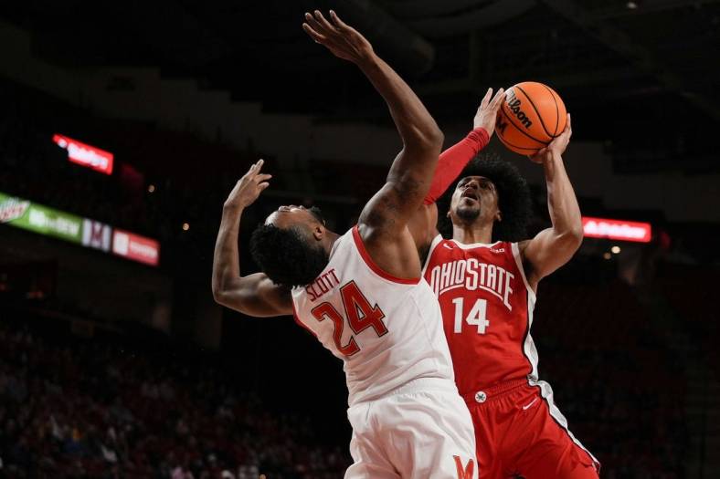 Jan 8, 2023; College Park, Maryland, USA; Ohio State Buckeyes forward Justice Sueing (14) shoots the ball while being guarded by Maryland Terrapins forward Donta Scott (24) in the first half at Xfinity Center. Mandatory Credit: Brent Skeen-USA TODAY Sports